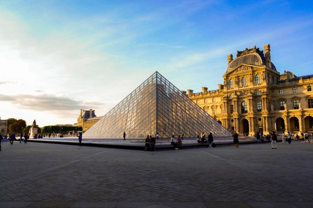 Louvre museum and the pyramid at sunset.
