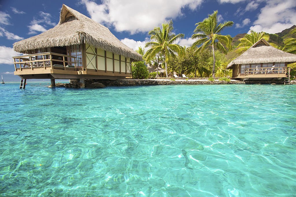 Over water bungalows with steps into amazing blue lagoon