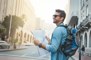 Man Looking At A Map While Touring